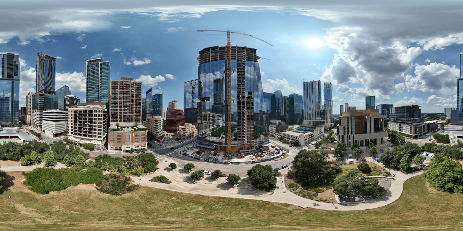 City skyline with skyscrapers and a building under construction.